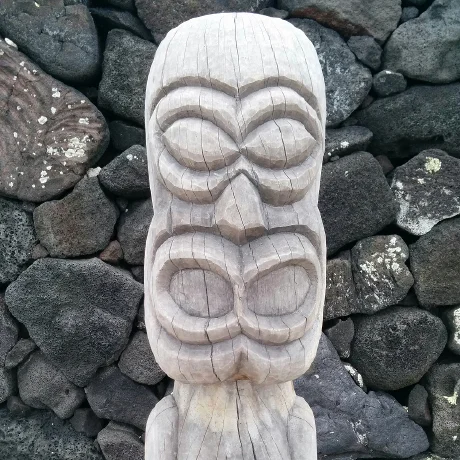 A carved wooden figure used as Iain's GitHub profile image.